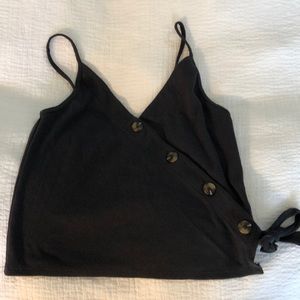 Tank with side buttons